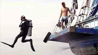 Diver jump from boat Koh Tao Thailand